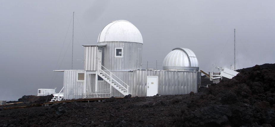 The domes of Mauna Loa Solar Observatory under rare cloudy skies (photo by Michael Thompson, NCAR Deputy Director, Mesa Lab, Boulder, CO)