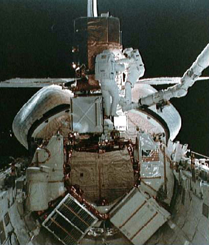 The satellite is loaded into the Space Shuttle's cargo bay, where it was successfully repaired by the shuttle astronauts