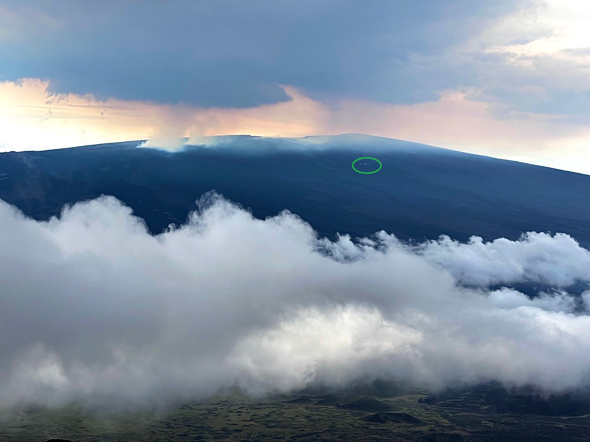 Image of Mauna Loa from Mauna Kea showing the eruption sites and MLSO location (green circle)