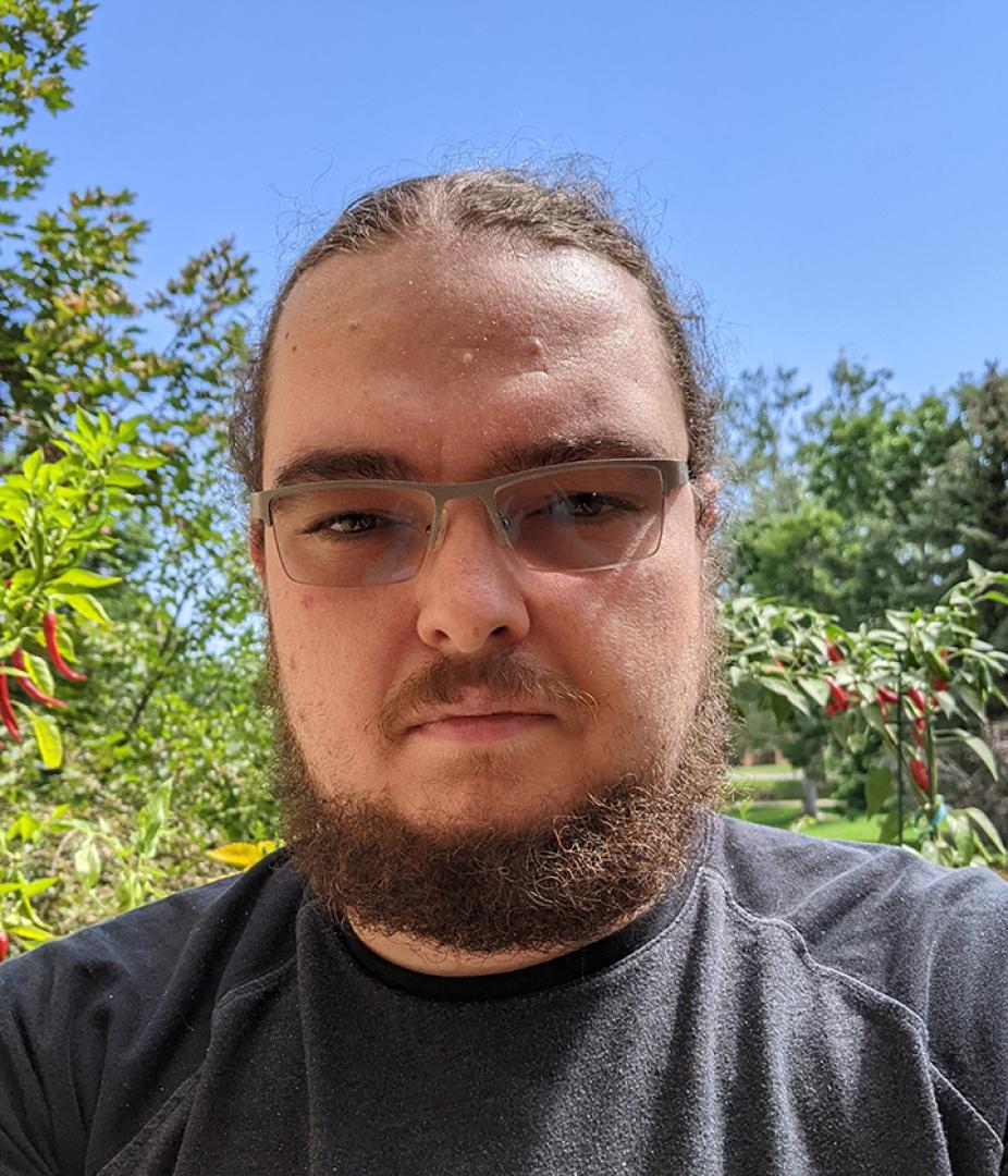 Head shot of Alin in the outdoors