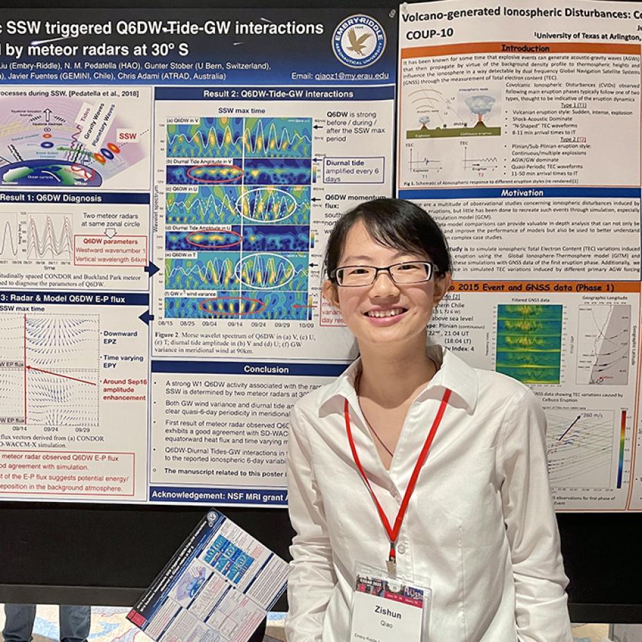 Zishun Qiao standing in front of her science poster