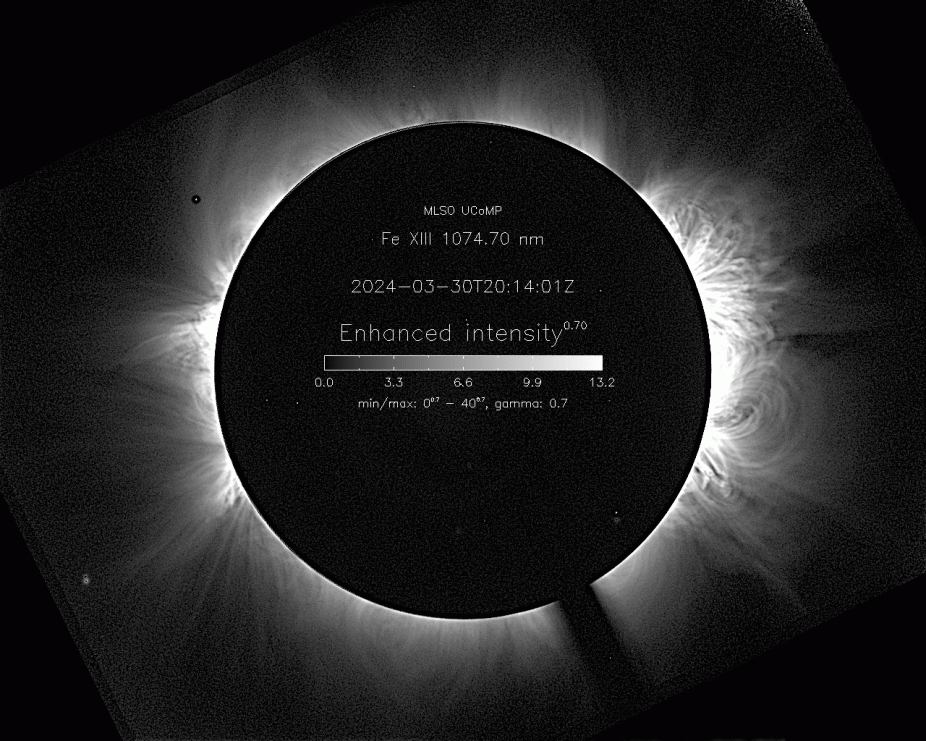 An image of the solar corona on March 30, 2024 in infrared light of the iron (Fe) atom emission line at a wavelength of 1074.7 nm. This image was taken with the UCoMP instrument at MLSO. The temperature of the plasma seen in this image is approximately 1.6 million degrees. It is hot enough to strip 12 electrons from these iron atoms to create the ionized state known as Fe XIII shown in the picture.
