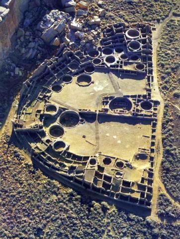 Aerial view of Pueblo Bonito at sunrise, with East to the top of the picture