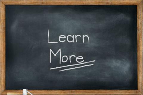 Blackboard with 'learn more'