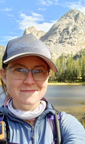 Elizabeth Bernhardt, headshot in outdoor mountain backdrop