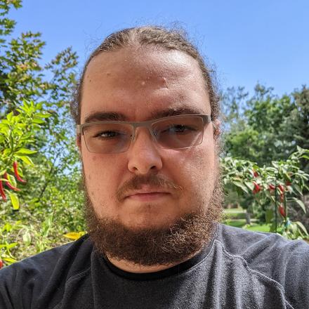 Head shot of Alin in the outdoors