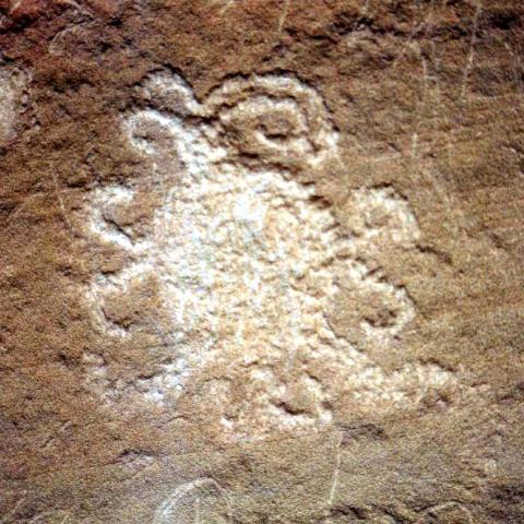 A petroglyph, suggestive of a solar eclipse, is found on the South side of a large boulder near the Una Vida ruin in Chaco Canyon