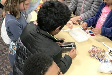 Photograph of children at 2020 Little Shop of Physics with hands-on activities